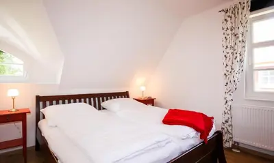 Ein Bett oder Betten in einem Zimmer der Unterkunft Windlicht