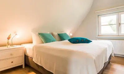 Ein Bett oder Betten in einem Zimmer der Unterkunft SiebenFinken