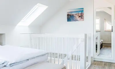 Ein Bett oder Betten in einem Zimmer der Unterkunft Darßzeit