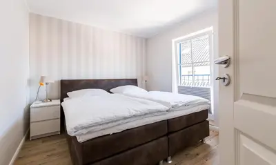 Ein Bett oder Betten in einem Zimmer der Unterkunft Darßzeit
