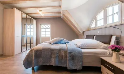 Ein Bett oder Betten in einem Zimmer der Unterkunft Pommernhus Ostseeblick
