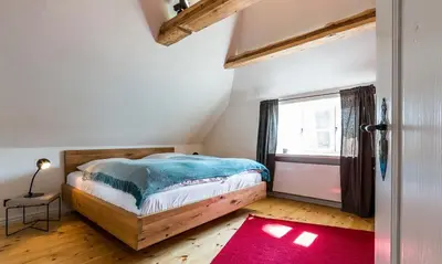 Ein Bett oder Betten in einem Zimmer der Unterkunft Büdnerei 19 Süd