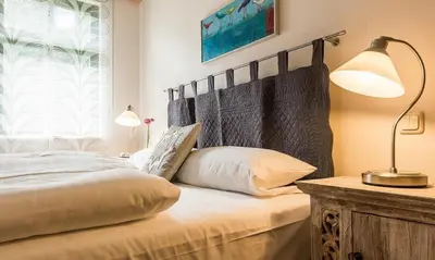 Ein Bett oder Betten in einem Zimmer der Unterkunft Alte Tischlerei 02