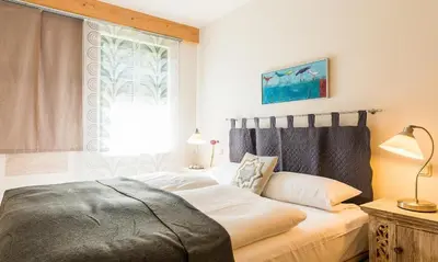 Ein Bett oder Betten in einem Zimmer der Unterkunft Alte Tischlerei 02