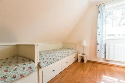 Ein Bett oder Betten in einem Zimmer der Unterkunft Hus in Luv