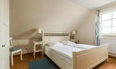 Ein Bett oder Betten in einem Zimmer der Unterkunft Hus in Lee