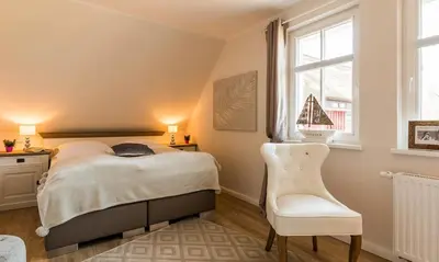 Ein Bett oder Betten in einem Zimmer der Unterkunft Sturmvogel