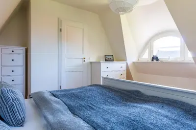 Ein Bett oder Betten in einem Zimmer der Unterkunft Haus am Boddenweg