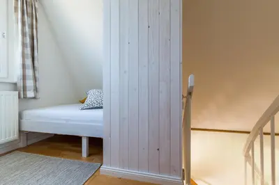 Ein Bett oder Betten in einem Zimmer der Unterkunft Haus am Boddenweg