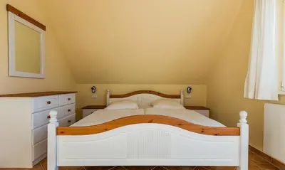 Ein Bett oder Betten in einem Zimmer der Unterkunft Madlen