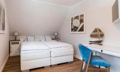 Ein Bett oder Betten in einem Zimmer der Unterkunft Wind & Segel