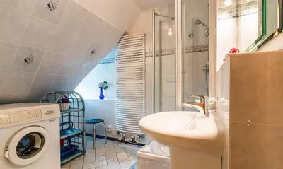 Ein Badezimmer in der Unterkunft Ahrenshooper Landhaus 04