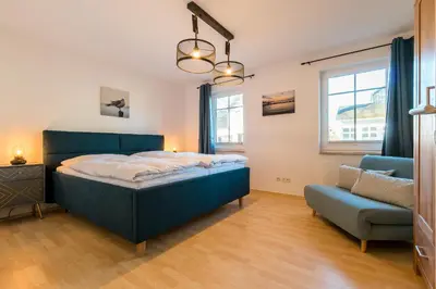 Ein Bett oder Betten in einem Zimmer der Unterkunft Haus Ostseenixe 01