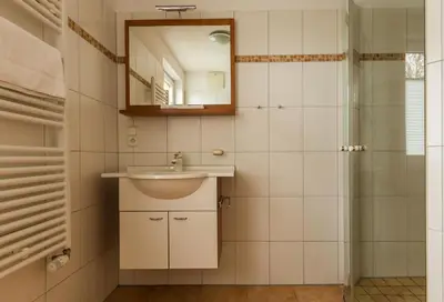 Ein Badezimmer in der Unterkunft Haus Ostseenixe 04