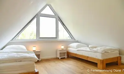 Ein Bett oder Betten in einem Zimmer der Unterkunft Düne 7