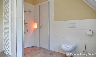 Ein Badezimmer in der Unterkunft Düne 7