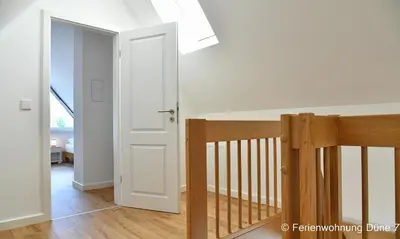 Ein Bett oder Betten in einem Zimmer der Unterkunft Düne 7