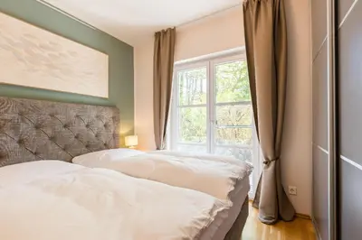 Ein Bett oder Betten in einem Zimmer der Unterkunft Strandleben 02 - Dora Koch-Stetter