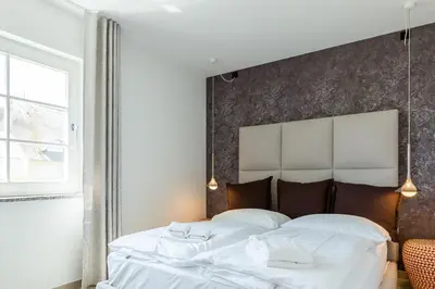 Ein Bett oder Betten in einem Zimmer der Unterkunft Pur A2