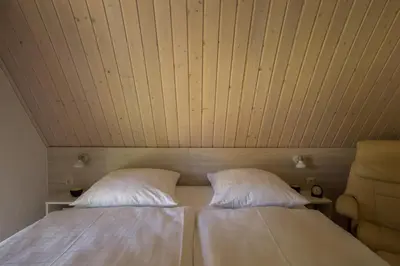 Ein Bett oder Betten in einem Zimmer der Unterkunft Tilda