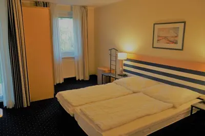 Ein Bett oder Betten in einem Zimmer der Unterkunft Am Kurhaus 410, Villa Kurpark PP 89