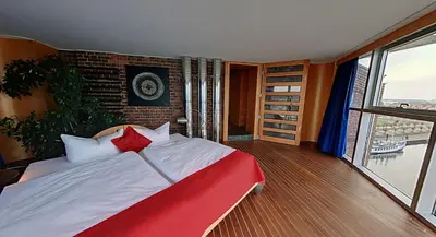 Ein Bett oder Betten in einem Zimmer der Unterkunft Speicher Barth - Superior-Hotel