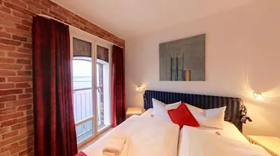 Ein Bett oder Betten in einem Zimmer der Unterkunft Speicher Barth - Superior-Hotel