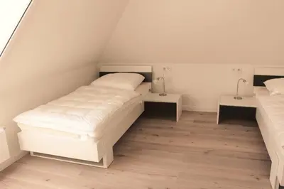 Ein Bett oder Betten in einem Zimmer der Unterkunft Strandperle - Whg 7c