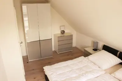 Ein Bett oder Betten in einem Zimmer der Unterkunft Strandperle - Whg 7c