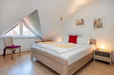 Ein Bett oder Betten in einem Zimmer der Unterkunft Ferienpark Freesenbruch Reihenhaus 5a - Eichhörnchen