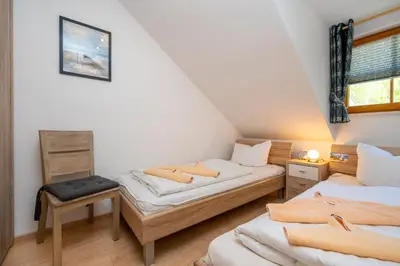 Ein Bett oder Betten in einem Zimmer der Unterkunft Ferienpark Freesenbruch Reihenhaus 5a - Eichhörnchen