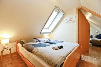 Ein Bett oder Betten in einem Zimmer der Unterkunft Ferienpark Freesenbruch Wohnung 1 4 -Ferienzeit