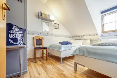 Ein Bett oder Betten in einem Zimmer der Unterkunft Ferienpark Freesenbruch Reihenhaus 7a - Otter