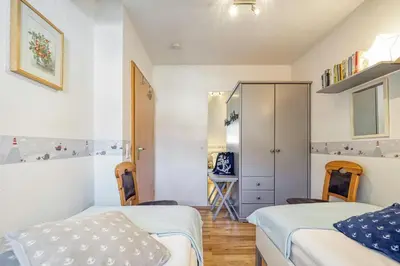 Ein Bett oder Betten in einem Zimmer der Unterkunft Ferienpark Freesenbruch Reihenhaus 7a - Otter