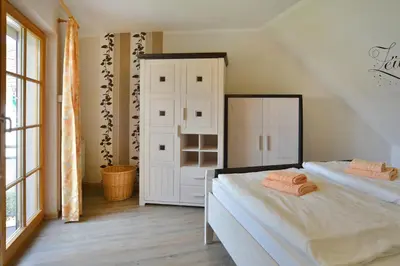 Ein Bett oder Betten in einem Zimmer der Unterkunft Ferienpark Freesenbruch Wohnung 1 6 - Freesenblick