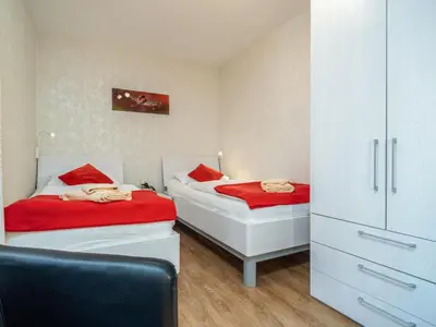 Ein Bett oder Betten in einem Zimmer der Unterkunft Ferienpark Freesenbruch Wohnung 2 1 - Möwennest