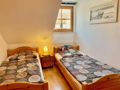 Ein Bett oder Betten in einem Zimmer der Unterkunft Ferienpark Freesenbruch Reihenhaus 8b - Muschel