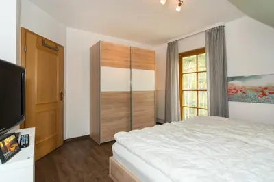 Ein Bett oder Betten in einem Zimmer der Unterkunft Ferienpark Freesenbruch Doppelhaushälfte 9 - Waldblick