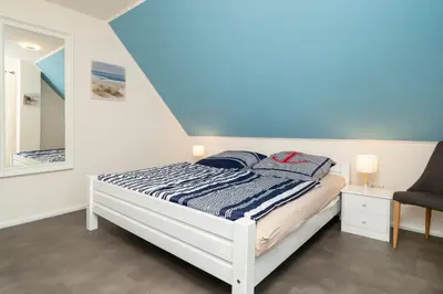 Ein Bett oder Betten in einem Zimmer der Unterkunft Ferienpark Freesenbruch Doppelhaushälfte 11a - Schwalbennest