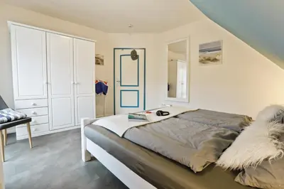 Ein Bett oder Betten in einem Zimmer der Unterkunft Ferienpark Freesenbruch Doppelhaushälfte 11a - Schwalbennest