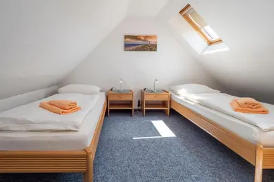 Ein Bett oder Betten in einem Zimmer der Unterkunft Ferienpark Freesenbruch Wohnung 3 5 - Muschelsucher