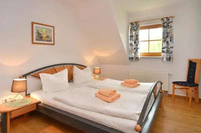 Ein Bett oder Betten in einem Zimmer der Unterkunft Ferienpark Freesenbruch Wohnung 3 5 - Muschelsucher