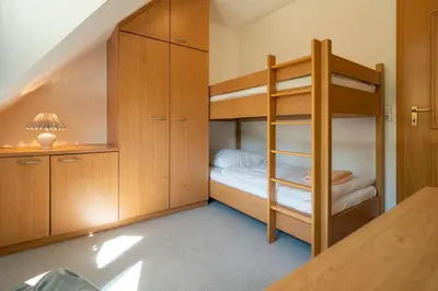 Ein Bett oder Betten in einem Zimmer der Unterkunft Ferienpark Freesenbruch Doppelhaushälfte 10 - Lieblingsplatz