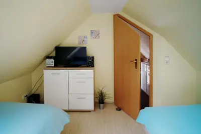 Ein Bett oder Betten in einem Zimmer der Unterkunft Ferienpark Freesenbruch Wohnung 3 6 - Frieda