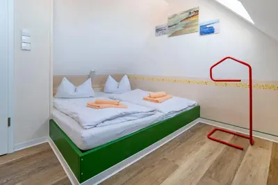 Ein Bett oder Betten in einem Zimmer der Unterkunft Ferienpark Freesenbruch Wohnung 1 5 - Amber