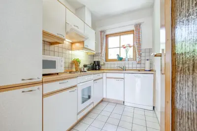 Küche/Küchenzeile in der Unterkunft Ferienpark Freesenbruch Wohnung 2 6 - Windrose