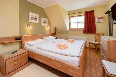 Ein Bett oder Betten in einem Zimmer der Unterkunft Ferienpark Freesenbruch Wohnung 4 5 - Kranichtanz