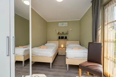 Ein Bett oder Betten in einem Zimmer der Unterkunft Ferienpark Freesenbruch Wohnung 4 3 - Inseltreff