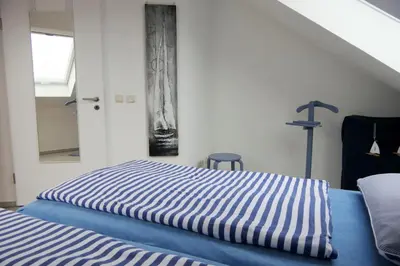 Ein Bett oder Betten in einem Zimmer der Unterkunft Parkresidenz am Hafen Wohnung HF 26 - Min Höög