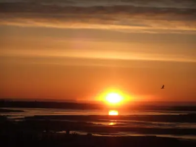 Blick auf den Sonnenuntergang/Sonnenaufgang von der Ferienwohnung aus oder aus der Nähe
